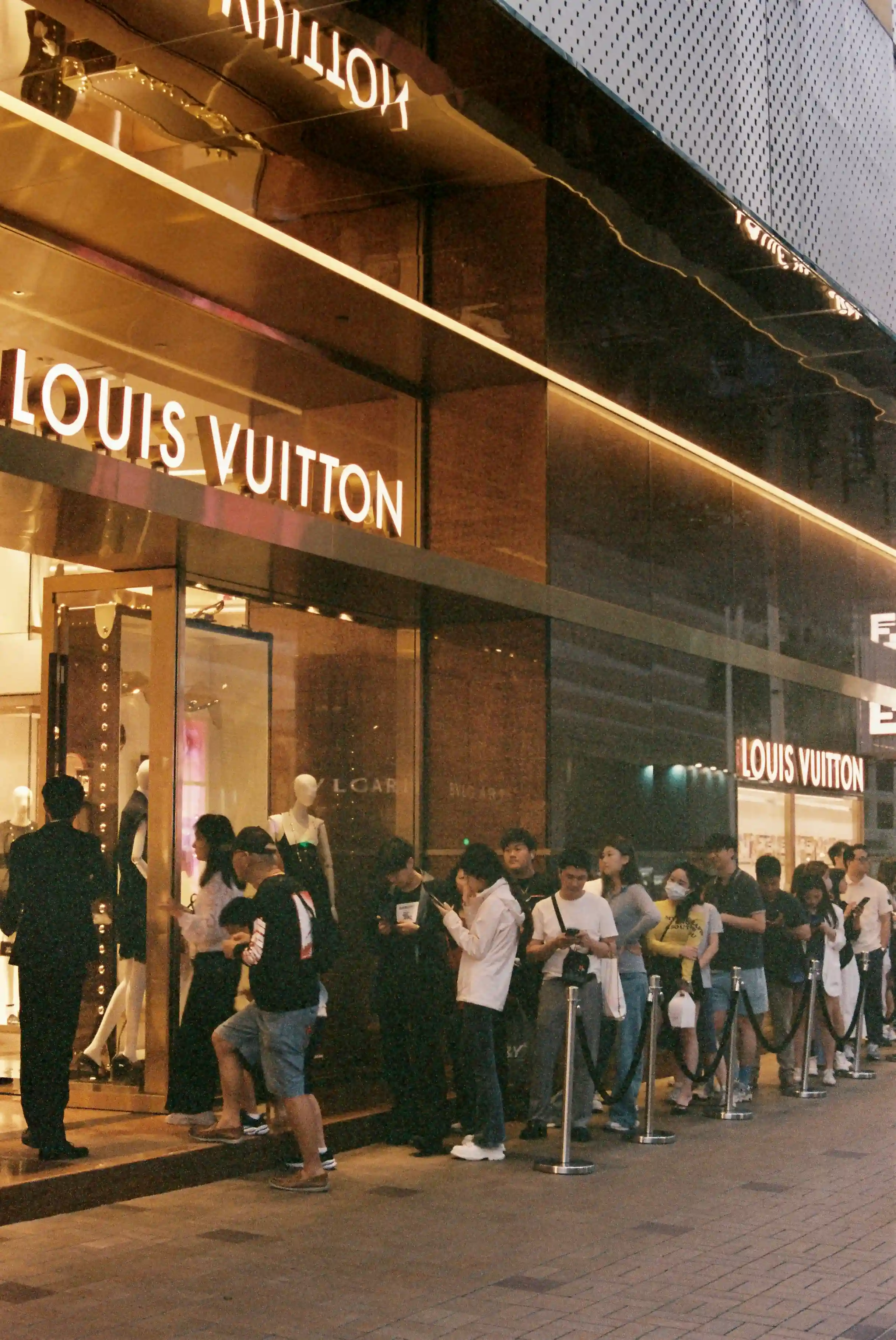 People queueing for Louis Vuitton in Hong Kong as it would be live essentials